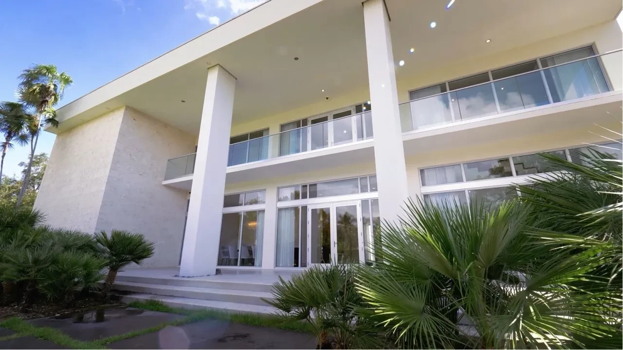 Old Cutler Road Residence — front facade with palm trees